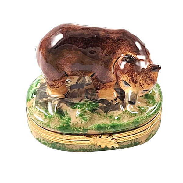 ###
A close-up image of a fluffy brown bear plush toy with a smiling face