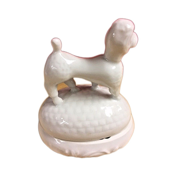 Detail of the French poodle on the white Limoges porcelain box