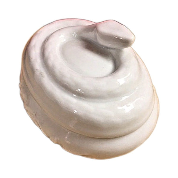 Detail of the coiled snake on the white Limoges porcelain box