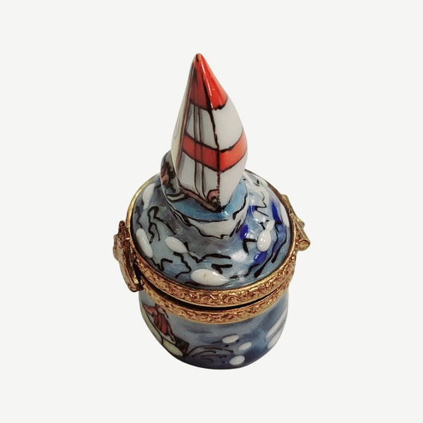 Vintage Limoges hand-painted miniature sailboat trinket box with blue waves and gold accents
