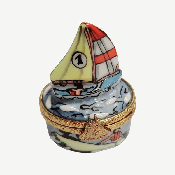 Vintage Limoges hand-painted porcelain trinket box shaped like a sailboat on water