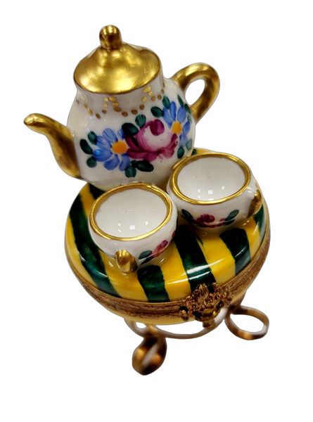 Tea set Teapot and Cups on Table